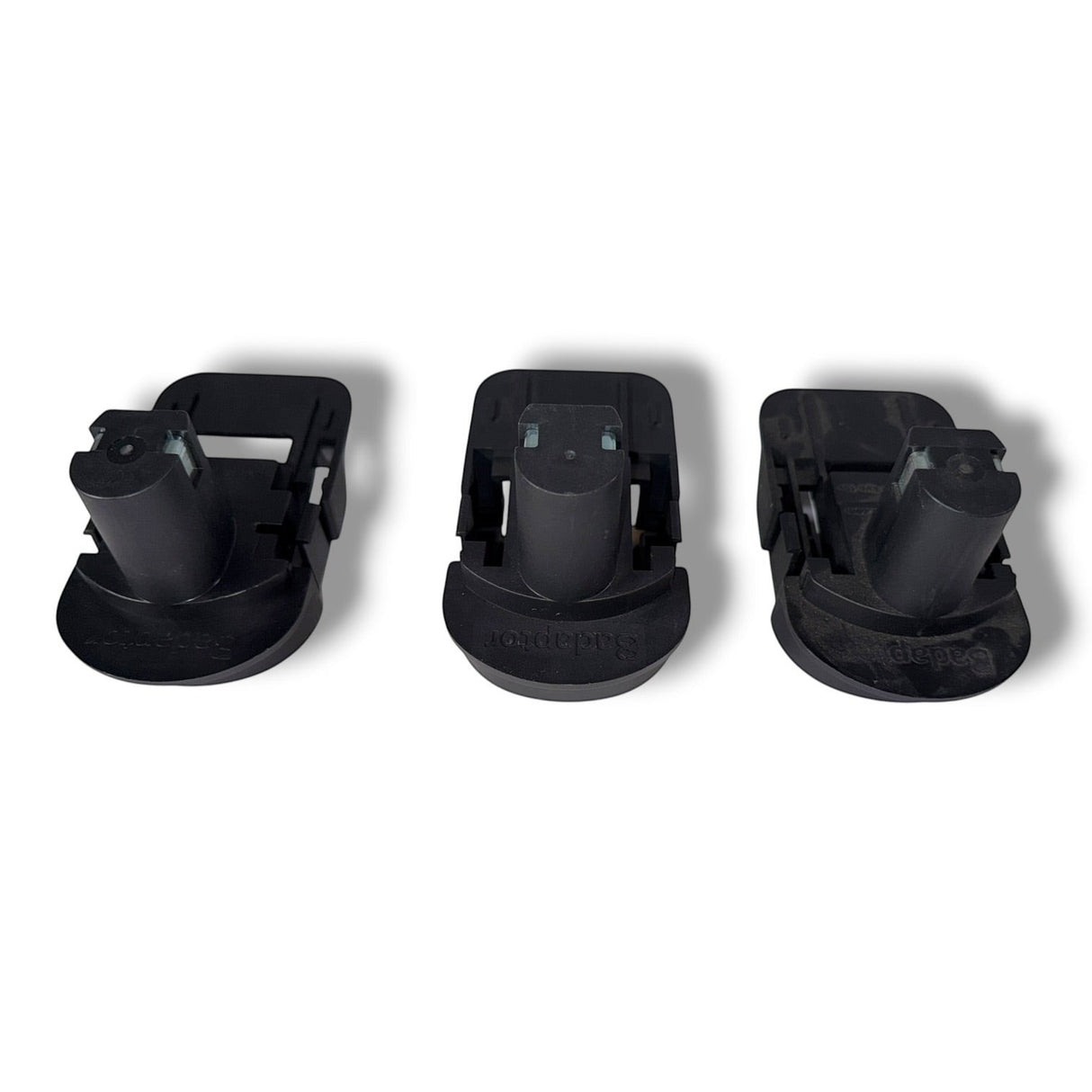 Anson PDR Trifecta adapters convert Ryobi batteries for Makita, DeWalt, and Milwaukee tools. Black plastic battery adapters.