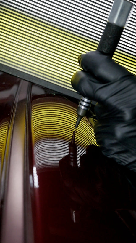 Anson PDR Dead Dent Tools Pee Wee ballistic knockdown tip being used to repair a sharp crown on a car panel