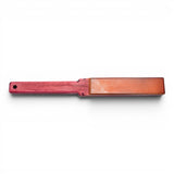Anson PDR wood paddle with a leather striking surface. Red wood handle with a hole for hanging.